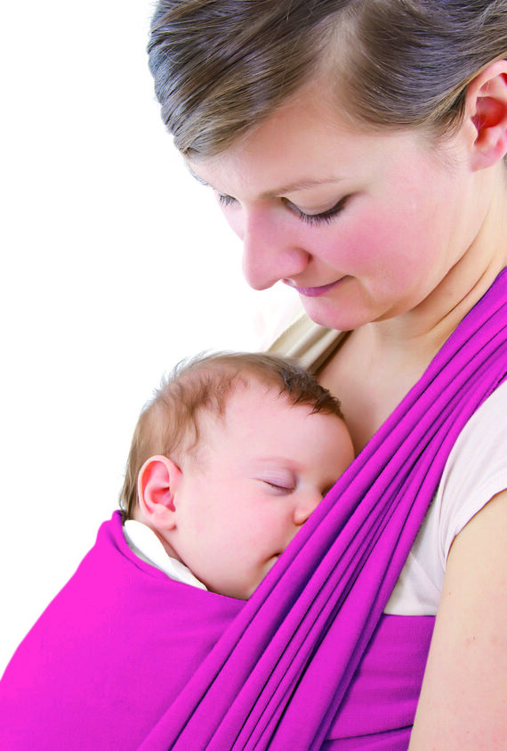 young mother carrying a  newborn sleepimg  baby