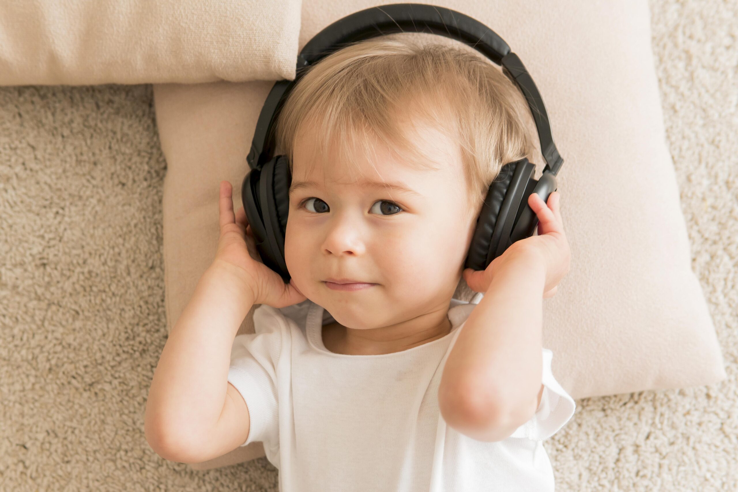 top-view-baby-wearing-headphones