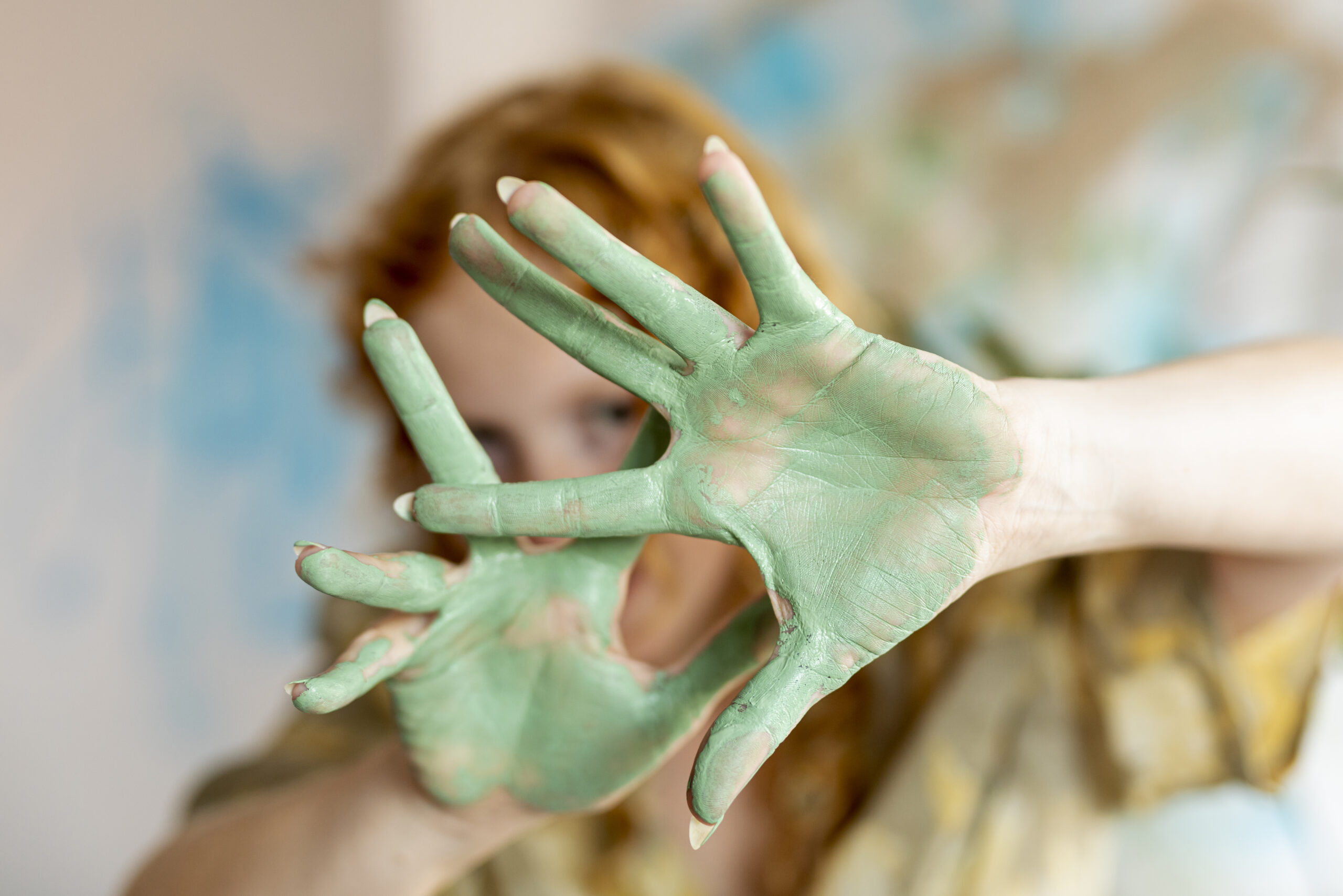 close-up-woman-showing-her-painted-palms